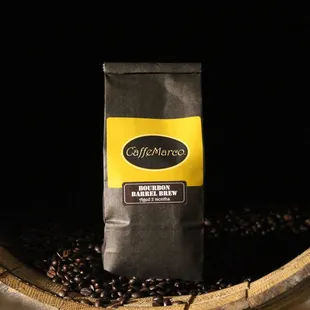 a bag of coffee beans in a barrel