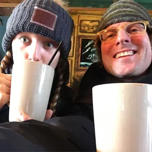 a man and a woman drinking coffee