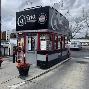 a coffee shop on the corner of a street
