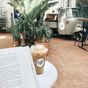 An iced chai latte in the courtyard