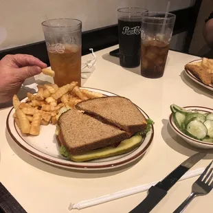 BLT with fries and sliced cucumbers
