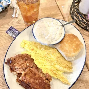 Corn beef hash. Eggs Scrambled dry. White sausage gravy. Biscuit.