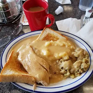 a plate of food and a cup of coffee