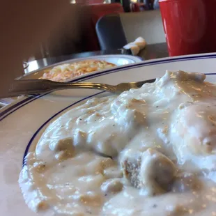 The gravy is too white (bland) and the biscuits are too soft (spongy unsteady if flaky). Ok tho