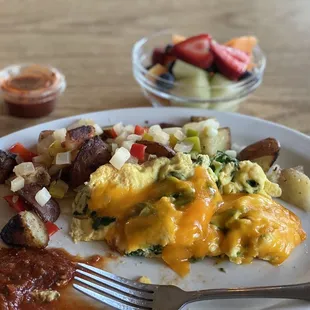 spinach &amp; cheddar chz scramble. country potatoes fresh fruit