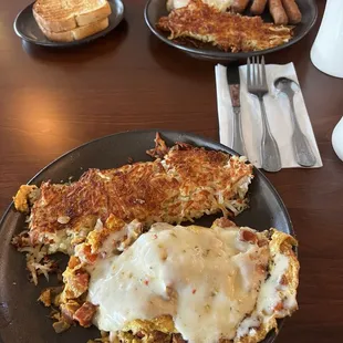 Linguica Omelet and hash browns and sausage and eggs with hash browns.