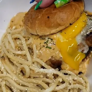 a plate of pasta and a sandwich