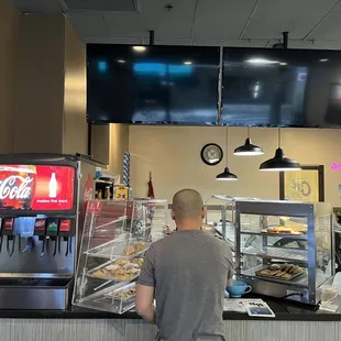 a man standing in front of the counter