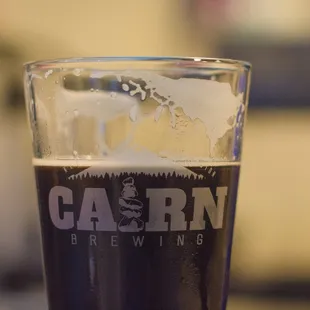 a pint of dark beer