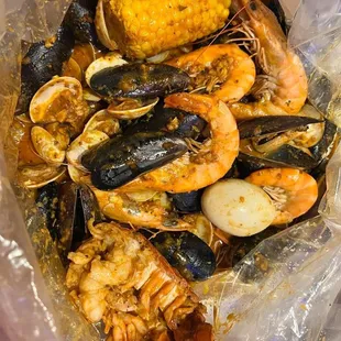 Shrimp,clams,lobster tail,egg,corn,mussels