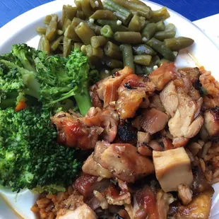 Bourbon chicken on top of what is supposed to be jambalaya and two veggie sides.