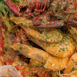 Shrimp, crawfish, with broccoli and corn sides covered in Super Ultimate sauce. Delicious and perfect size for 2.