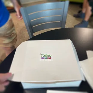 a box of pizza on a table