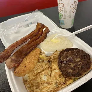 Eggs, grits, bacon, sausage and a hash brown.