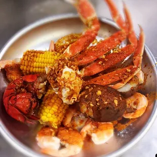 Combo A: 1/2 lb each of snow crab and shrimp,  lobster tail, potatoes and corn in a garlic butter sauce, medium heat