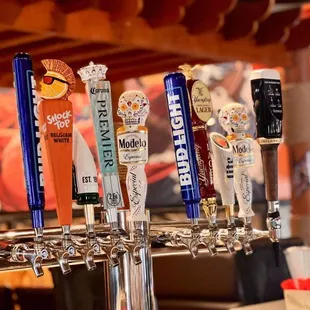 a row of beer taps