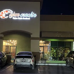 cars parked in front of a restaurant