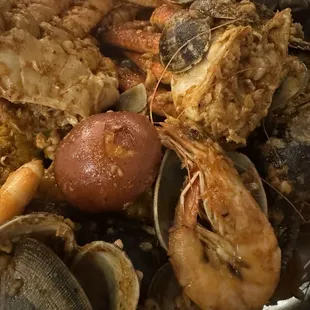 Mussels, clams, shrimp head on and snow crab legs potato and corn included