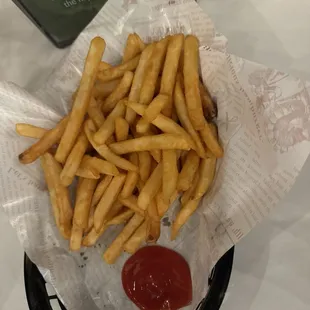 Fries perfectly salted with a side of ketchup