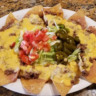 New addition to the menu, now serving appetizers, Nachos with homemade queso dip ( no store bought ), grown beef, beans, and salad