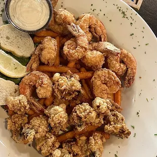 a plate of shrimp and fries