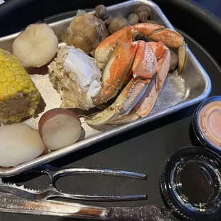 Dungeness crab with sides:  corn, potato, garlic, mushroom