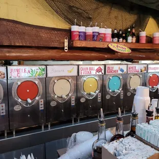 a row of soda machines