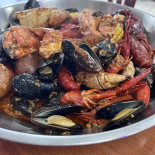 crawfish, crab claw, and mussels