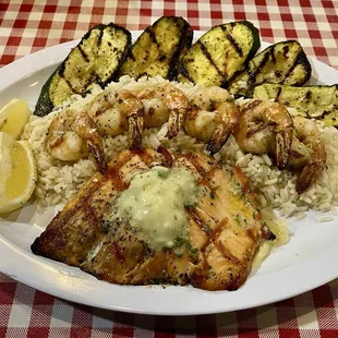 Grilled Salmon and shrimp in garlic butter with rice and grilled zucchini