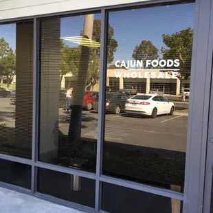 a reflection of a car in the window