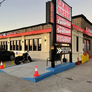 a motorcycle parked in front of a restaurant