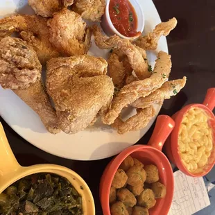 Fried chicken, fried catfish, fried shrimp, fried okra, Mac and cheese, greens. The honey sauce for the fish was really good!