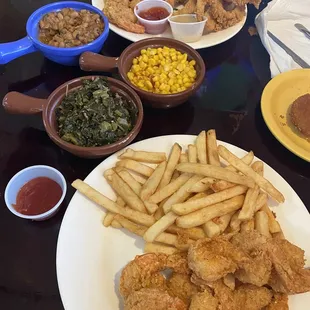 Shrimp and fries combo, catfish and shrimp combo, and collard greens.
