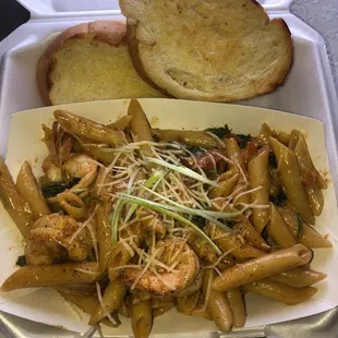 a plate of pasta and bread