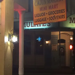 the entrance to a liquor and grocery store