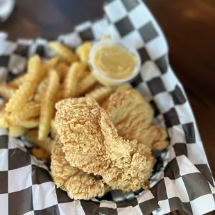 a basket of fried fish and chips