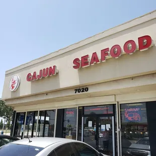 a car parked in front of a restaurant