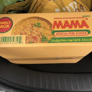 a box of food in the trunk of a car