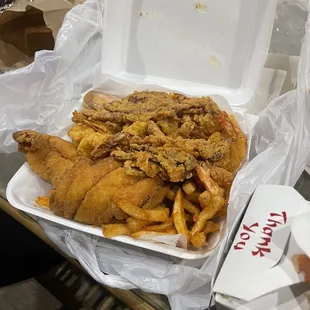 a box of fried chicken and french fries