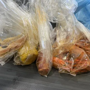 plastic bags of food on a conveyor belt