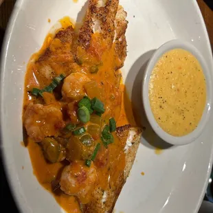 Orange roughy with Cajun shrimp sauce.