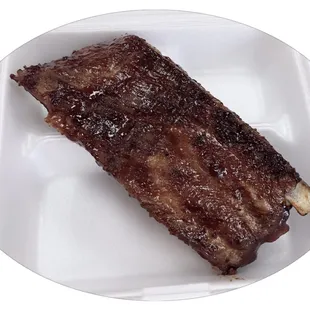 Slab of bar b que rib so tender and yummy off grill ...