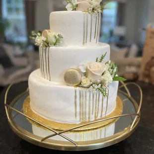 a three tiered white wedding cake