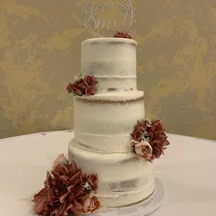 a wedding cake with flowers