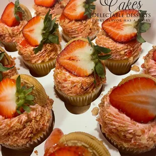 a box of cupcakes with strawberries