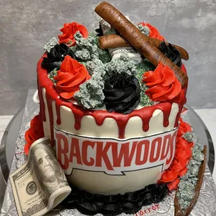 a cake covered in red icing and money
