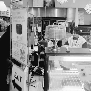 a woman working behind a counter