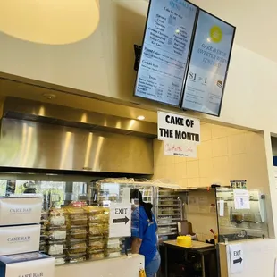 a woman standing in front of the counter