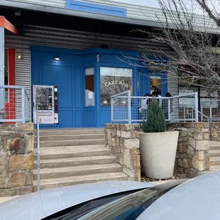 the entrance to a cake shop
