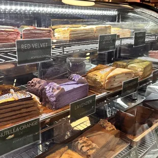 a variety of pastries in a display case